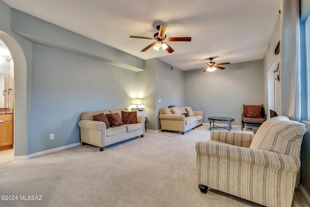 living room with light carpet and ceiling fan