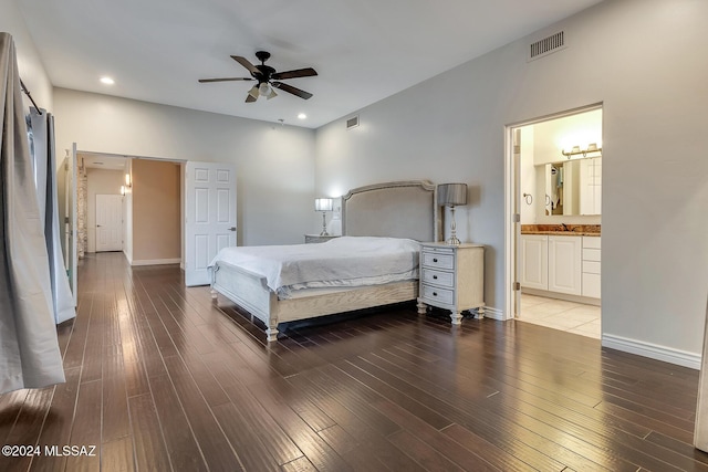 bedroom with connected bathroom, ceiling fan, dark hardwood / wood-style flooring, and sink