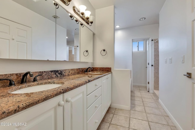 bathroom with a shower and vanity