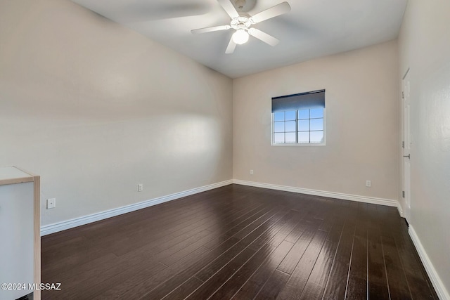 unfurnished room with dark hardwood / wood-style floors and ceiling fan