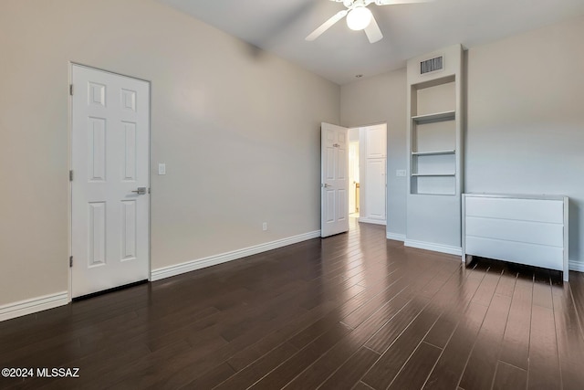 unfurnished bedroom featuring ceiling fan and dark hardwood / wood-style floors