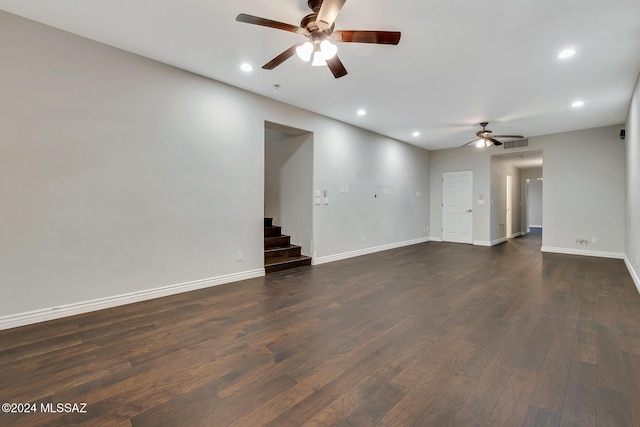 unfurnished living room featuring dark hardwood / wood-style floors and ceiling fan