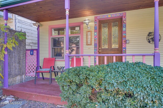 doorway to property with covered porch