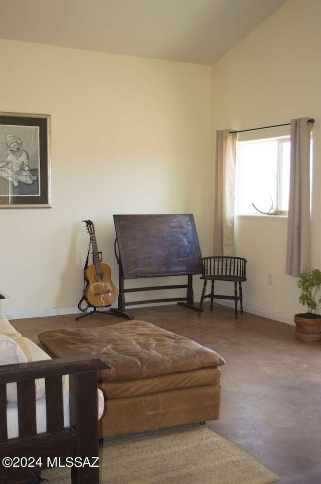 living area featuring vaulted ceiling