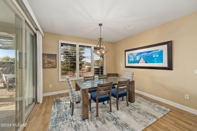 dining space with light wood-type flooring