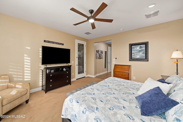 bedroom featuring light colored carpet and ceiling fan