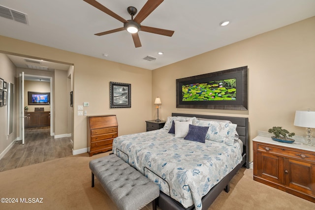 carpeted bedroom with ceiling fan