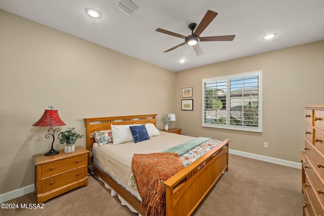 carpeted bedroom featuring ceiling fan