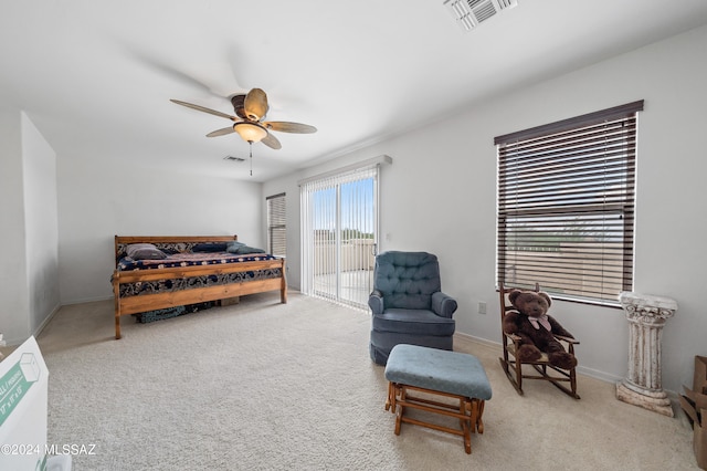 carpeted bedroom featuring access to exterior and ceiling fan