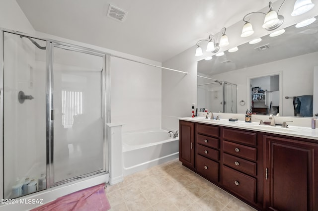 bathroom featuring tile patterned floors, vanity, and plus walk in shower