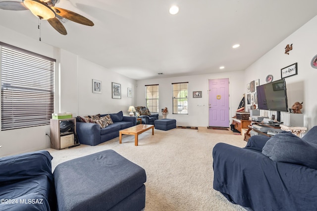 living room with a ceiling fan, recessed lighting, and light carpet