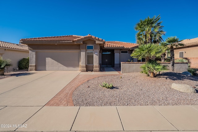 view of front of property with a garage