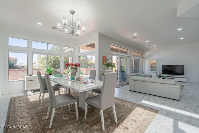 dining space with a notable chandelier