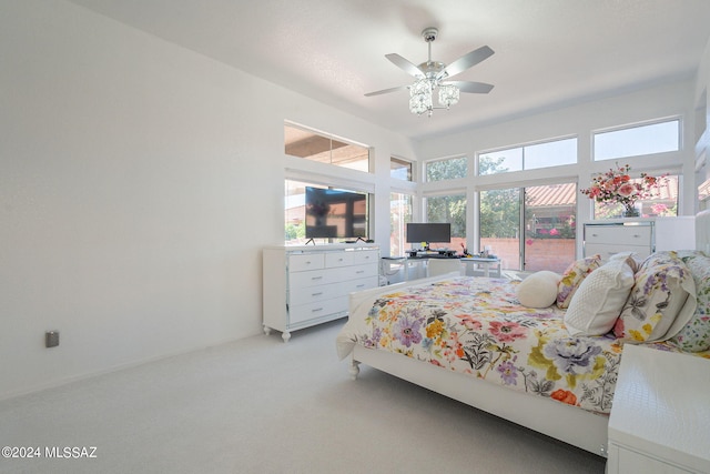 bedroom with light carpet and ceiling fan