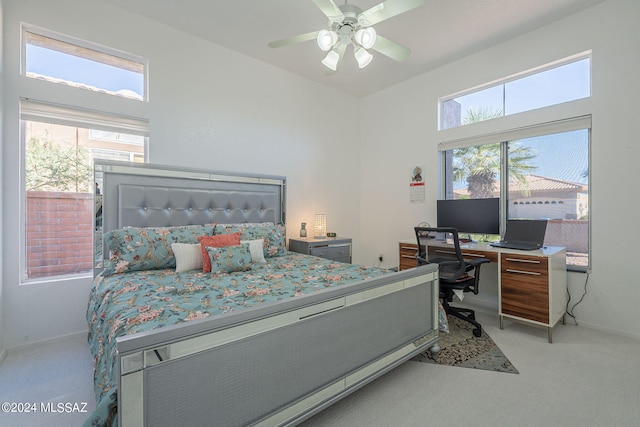 bedroom featuring light carpet and ceiling fan