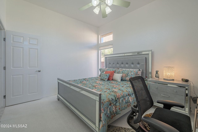 bedroom with light colored carpet and ceiling fan