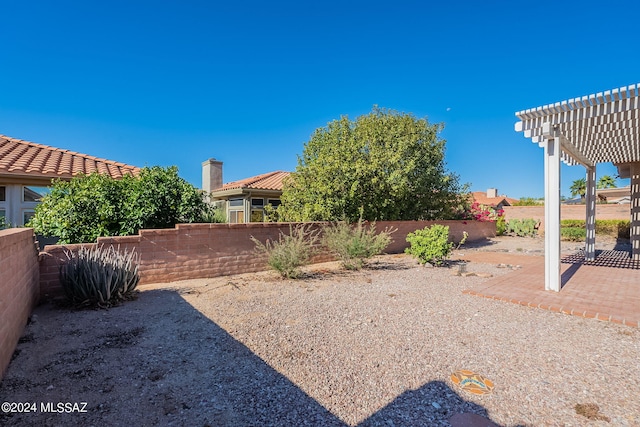 view of yard featuring a patio area and a pergola