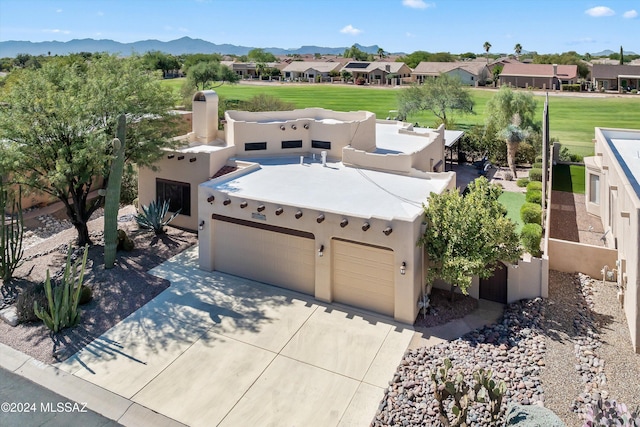 birds eye view of property featuring a mountain view