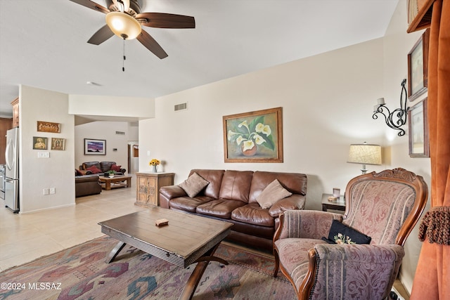 living room with light tile patterned floors and ceiling fan