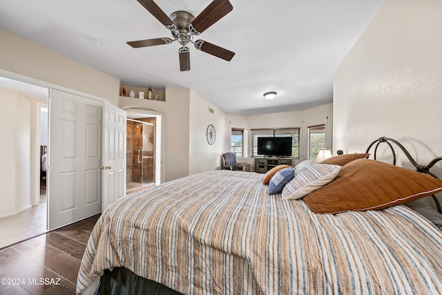 bedroom featuring ensuite bathroom and ceiling fan