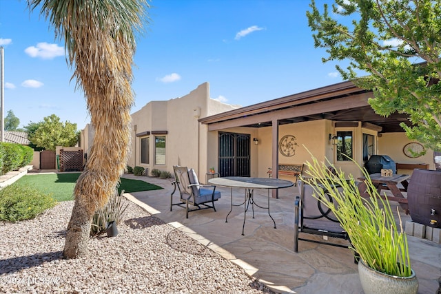 back of house featuring a patio area