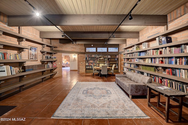 living area featuring wood ceiling, track lighting, tile patterned floors, and beamed ceiling