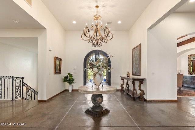 foyer featuring a chandelier