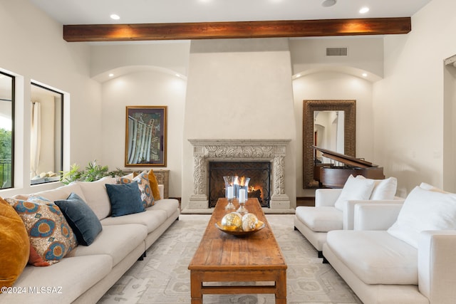 living room with beam ceiling