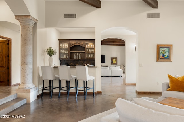 bar with beam ceiling and ornate columns