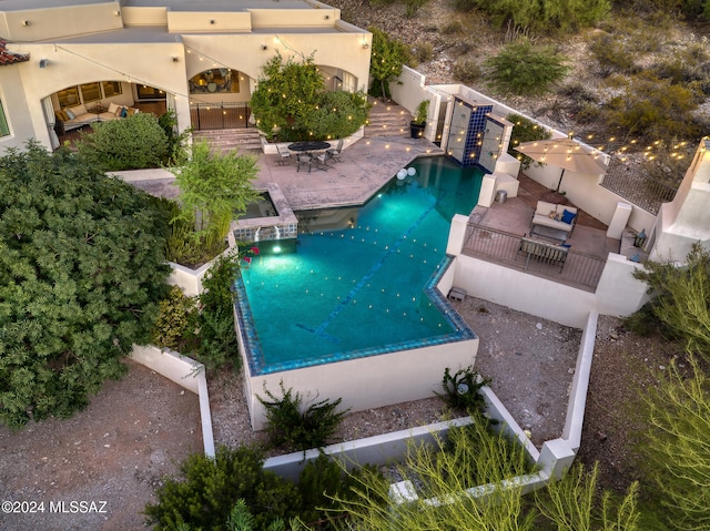 view of swimming pool featuring a patio area