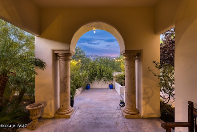 view of patio terrace at dusk