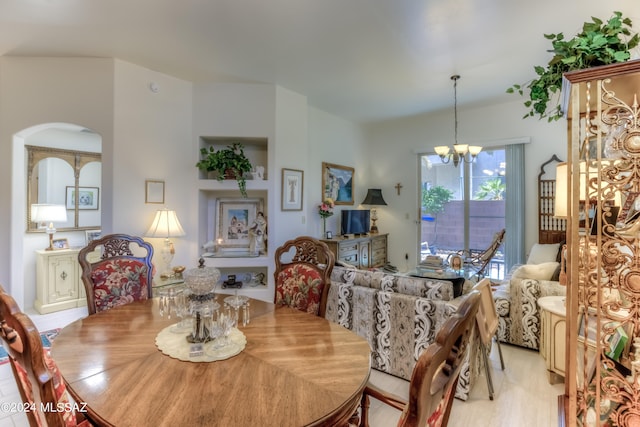 dining space with a chandelier