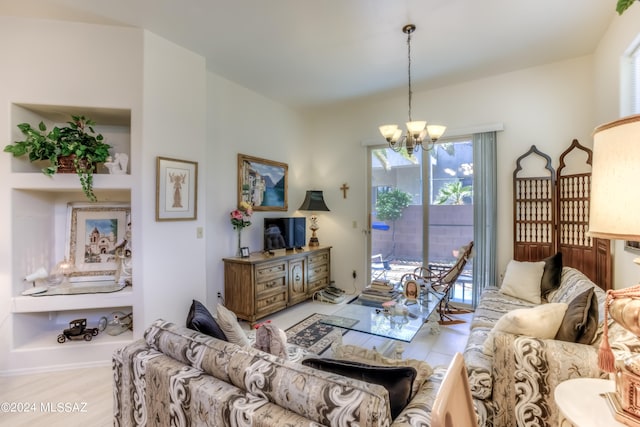 living room featuring an inviting chandelier and light wood-type flooring