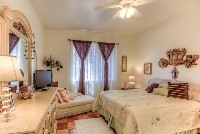 bedroom featuring ceiling fan and light parquet floors