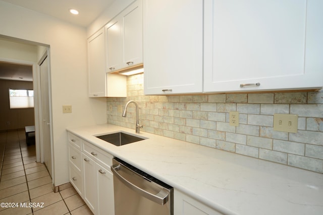 kitchen featuring white cabinetry, sink, and stainless steel dishwasher