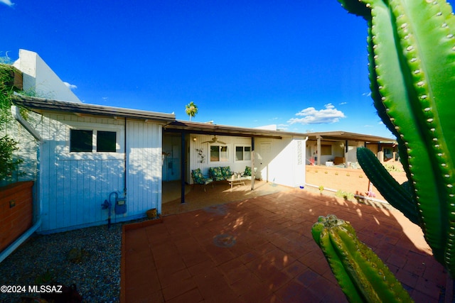 back of property featuring a patio area