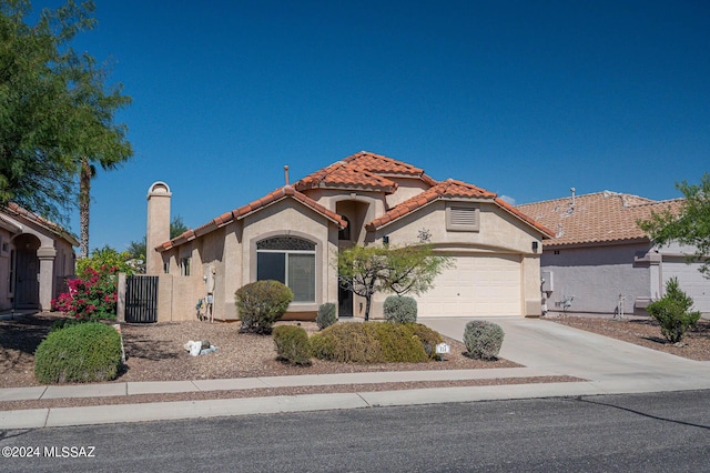 mediterranean / spanish-style house featuring a garage