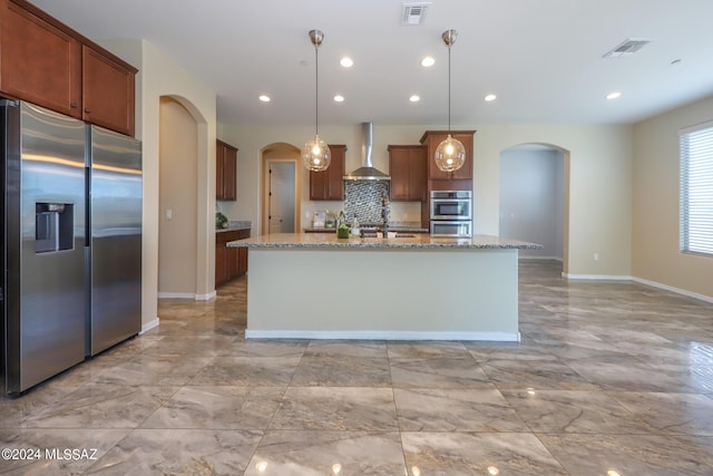 kitchen with stainless steel fridge with ice dispenser, arched walkways, visible vents, and wall chimney range hood