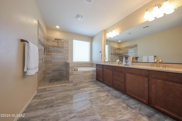 full bath with double vanity, walk in shower, a bath, visible vents, and a sink