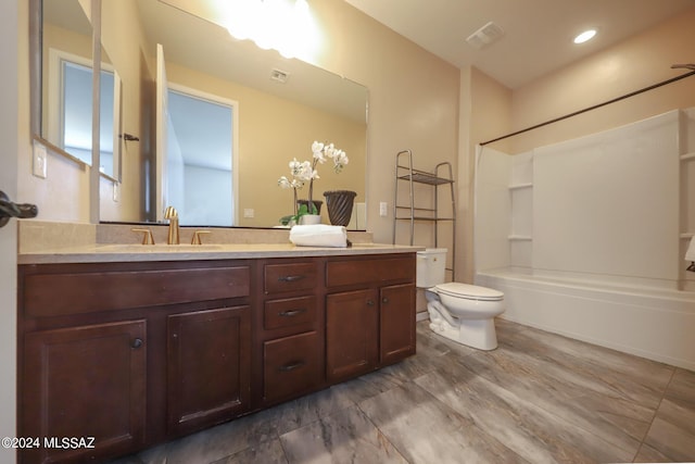 full bathroom with visible vents, toilet, bathtub / shower combination, and vanity