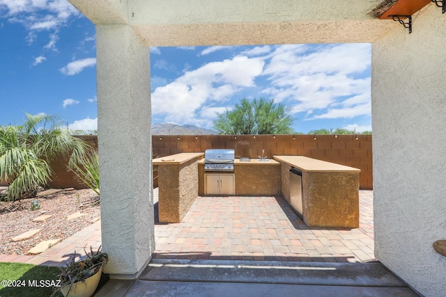 view of patio featuring a fenced backyard, a grill, and area for grilling