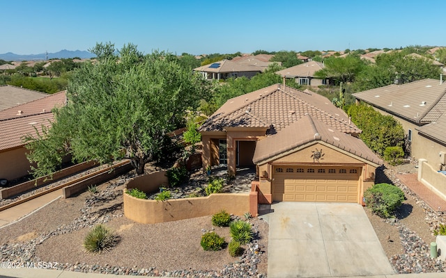 birds eye view of property with a mountain view