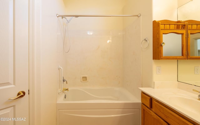 bathroom featuring bathing tub / shower combination and vanity