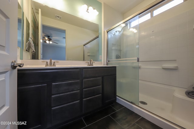 bathroom featuring an enclosed shower, vanity, ceiling fan, and tile patterned floors