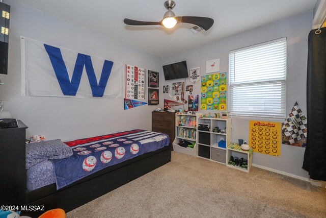 carpeted bedroom with ceiling fan