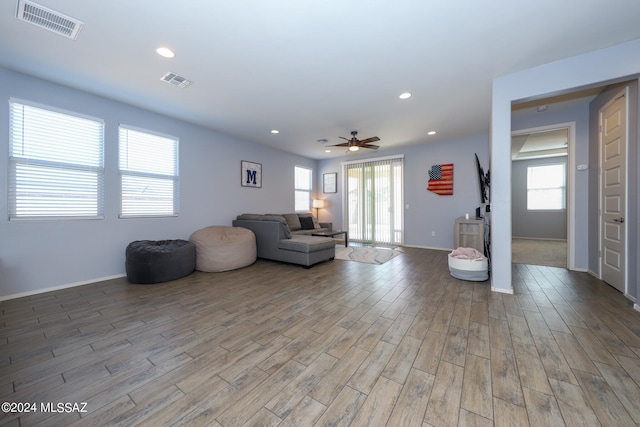 unfurnished living room featuring light hardwood / wood-style floors and ceiling fan