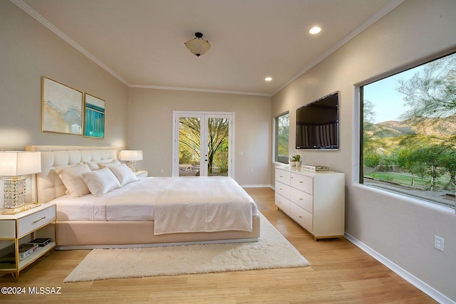 bedroom with light hardwood / wood-style floors and ornamental molding