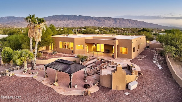 rear view of property with a mountain view