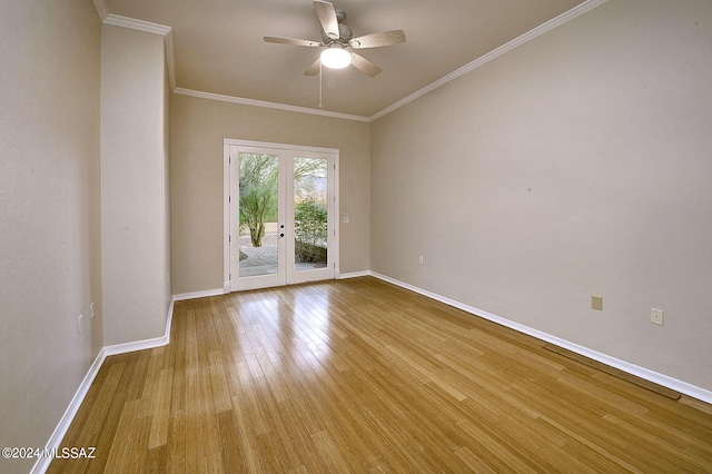 spare room featuring ceiling fan, light hardwood / wood-style floors, crown molding, and french doors