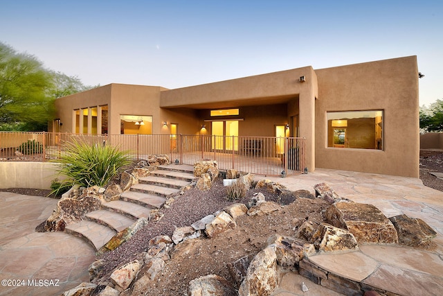 rear view of property featuring a patio area